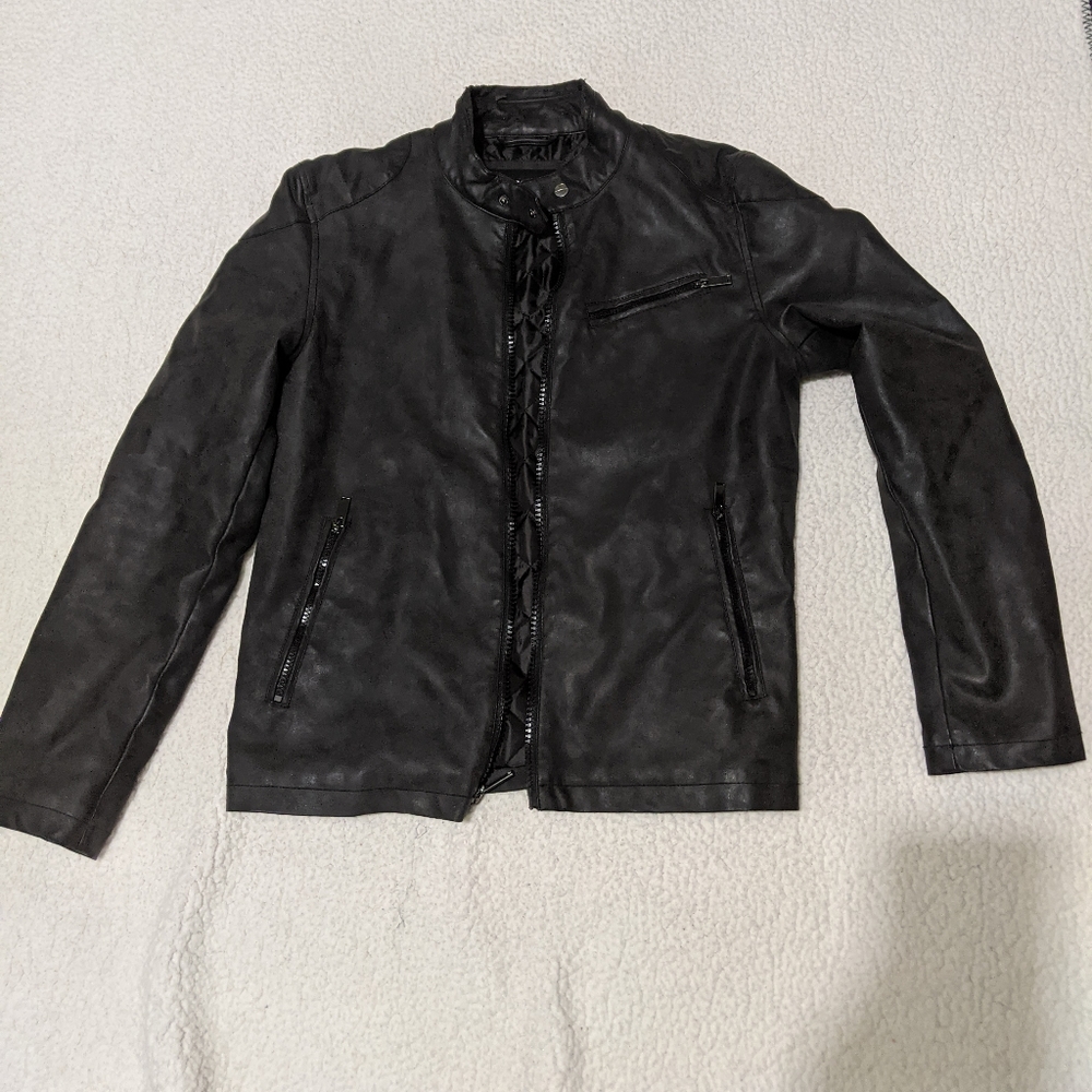 Guess jacket with some crumbling in neck area